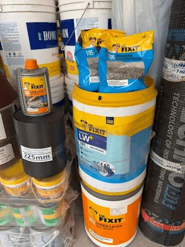 Dr. Fixit waterproofing products stacked in Build and Coat warehouse